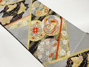 丸文に花々・鳳凰・蝶模様織出し袋帯